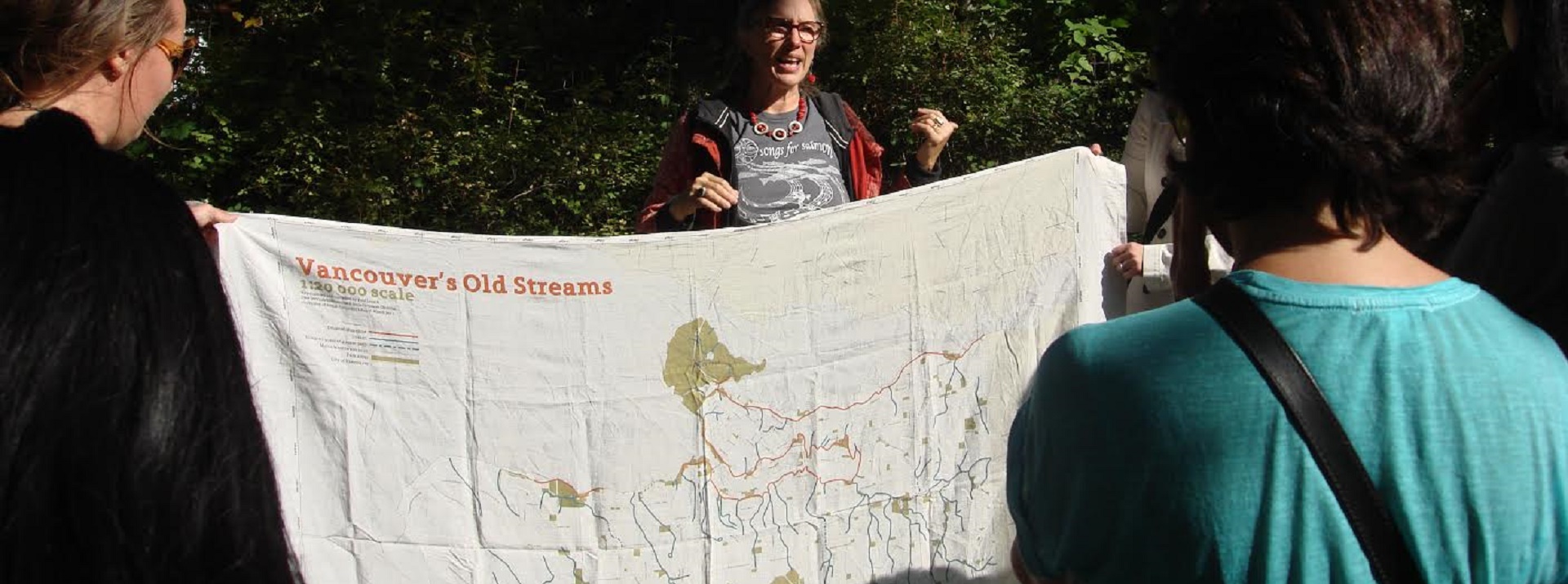Courtesy of Megan Spencer_Carmen Rosen of Still Moon Arts Society shares a map of Vancouver's lost streams at Watersheds 2016 Courtesy of Megan Spencer, Carmen Rosen of Still Moon Arts Society shares a map of Vancouver's lost streams at Watersheds 2016