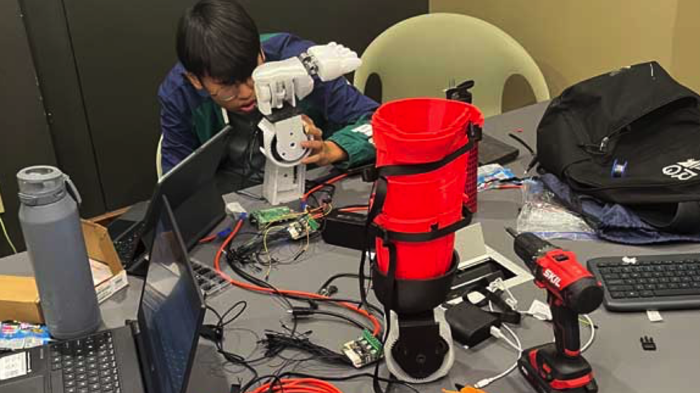 Changyoung Kim working on the NeuroFlex prototype. Credit: Society for Science
