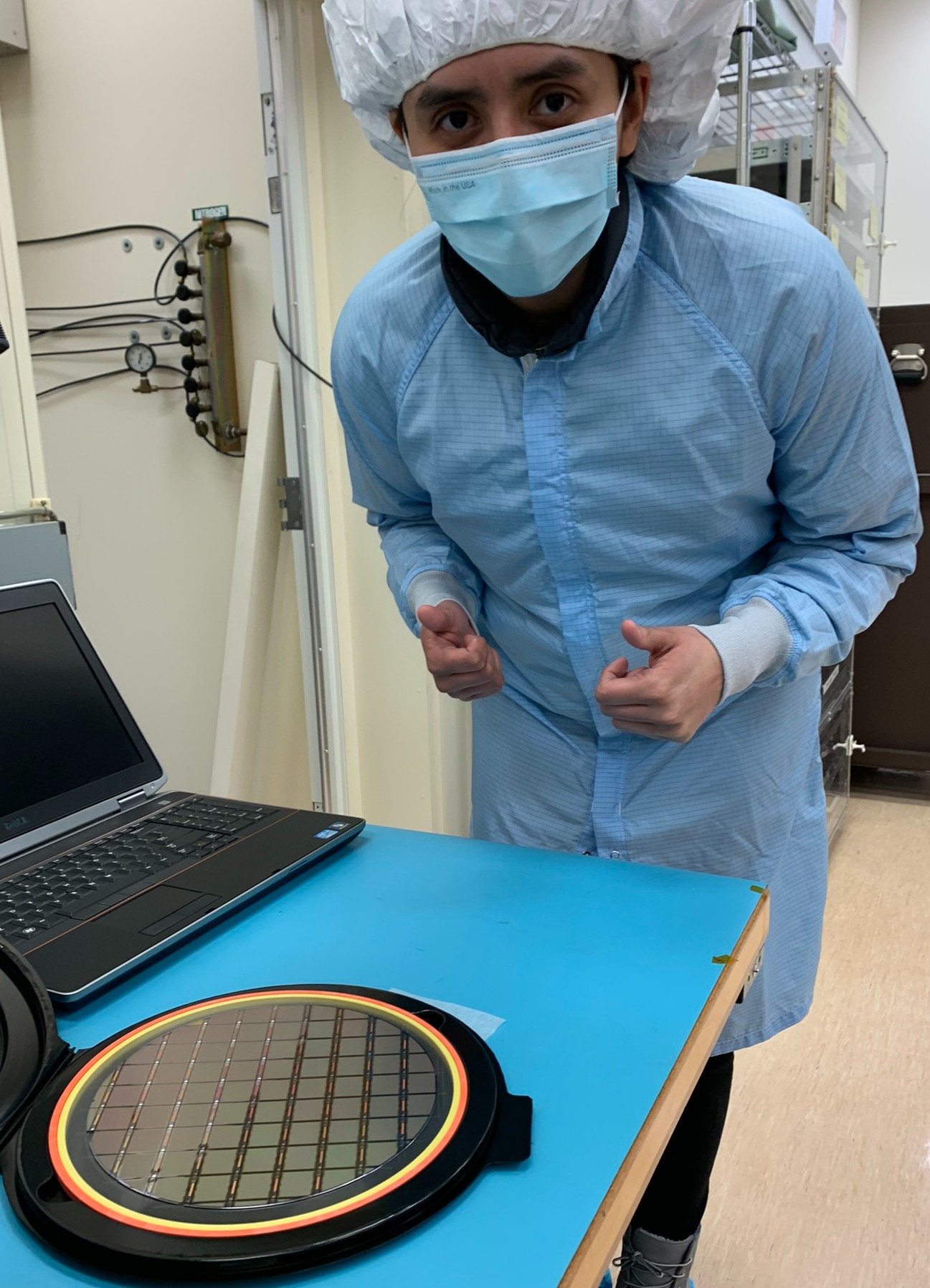 University of Chicago postdoctoral researcher Brenda Cervantes with newly fabricated sensors. Credit: Juan Estrada/University of Chicago
